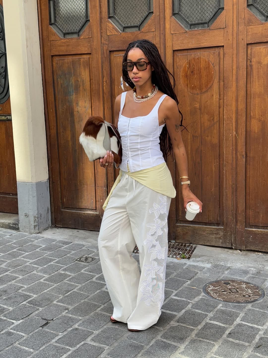woman wearing scarf belt early fall 2025 fashion trends