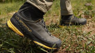 Person's feet wearing La Sportiva TX5 GTX hiking boot