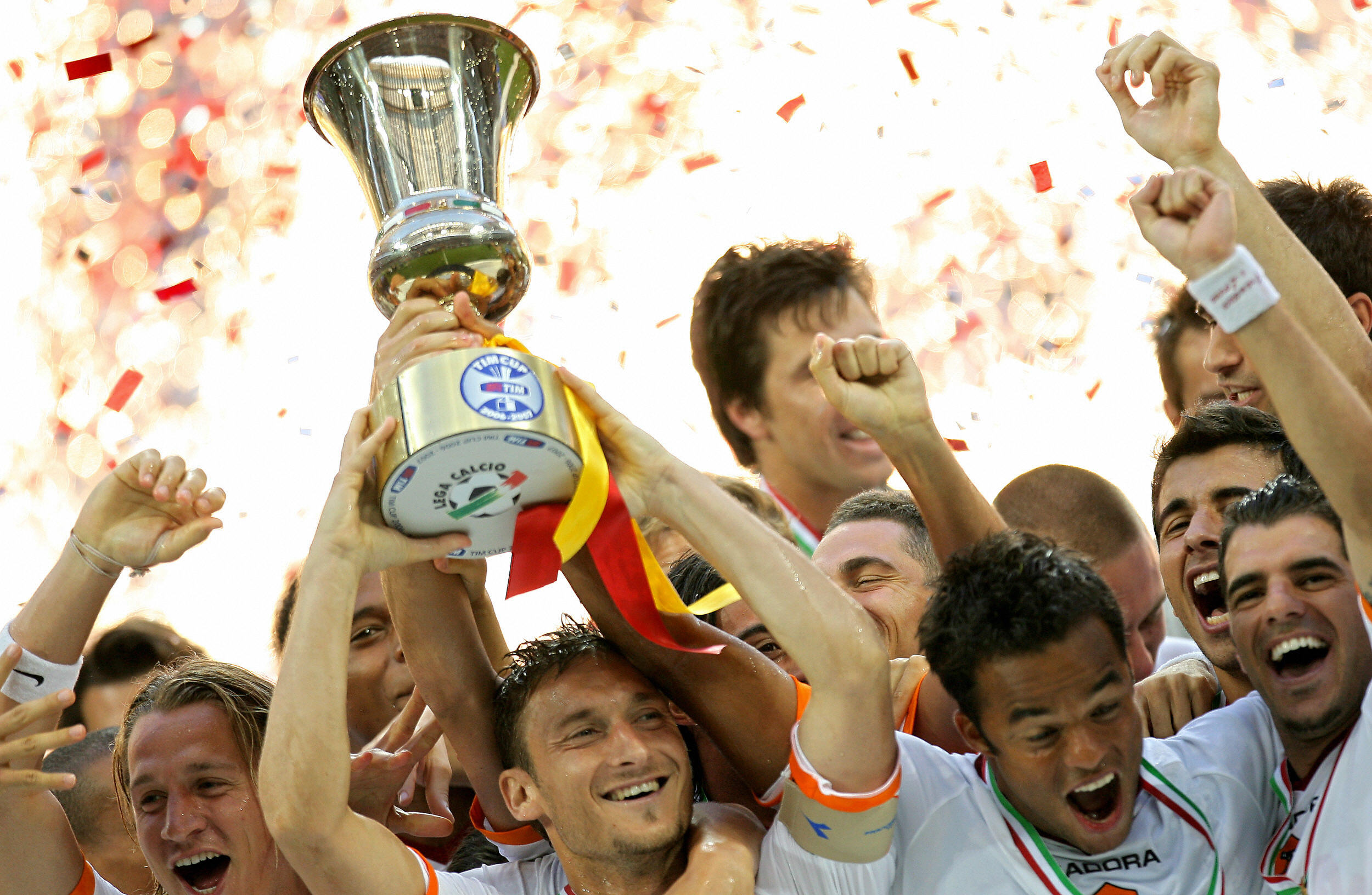 Roma captain Francesco Totti celebrates with the Coppa Italia trophy with his team-mates after victory in the final against Inter in May 2007.