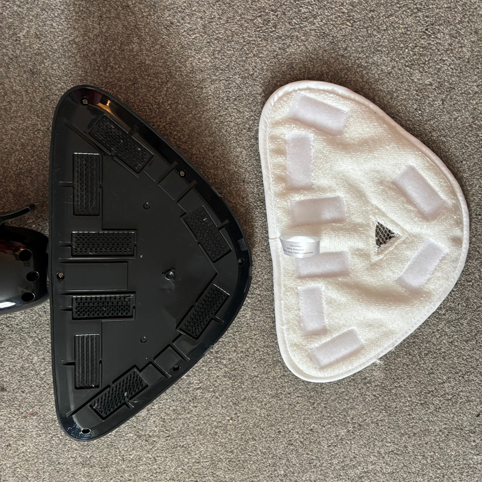 mop pad and black base lay side by side