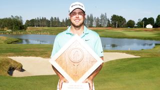 Pierceson Coody with the Live and Work in Maine Open trophy