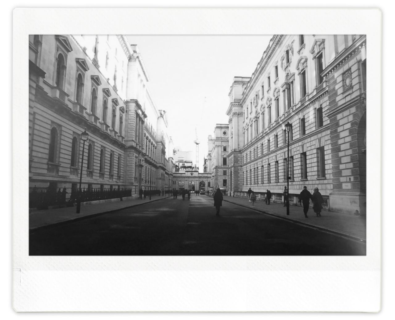 A street in central London flanked by large buildings