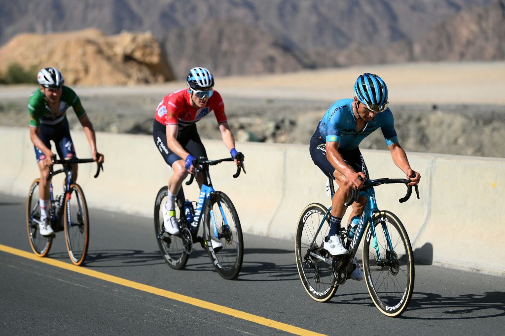 YITTI HILLS OMAN FEBRUARY 14 LR Mauri Vansevenant of Belgium and Team Soudal Quick Step Green Points Jersey Matteo Jorgenson of The United States and Movistar Team Red Leader Jersey and Alexey Lutsenko of Kazakhstan and Astana Qazaqstan Team compete during the 12th Tour of Oman 2023 Stage 4 a 2049km stage from Izki to Yitti Hills 147m TourofOman on February 14 2023 in Yitti Hills Oman Photo by Alex BroadwayGetty Images