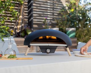 Tabletop outdoor gas pizza oven in sleek oval design