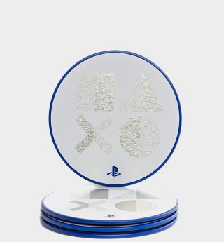 PS5 coasters against a plain background