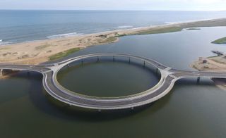 The bridge's circular design purposely helps slow cars down, so as to minimise their impact on the site
