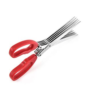 A pair of red handled scissors with multiple in-line blades