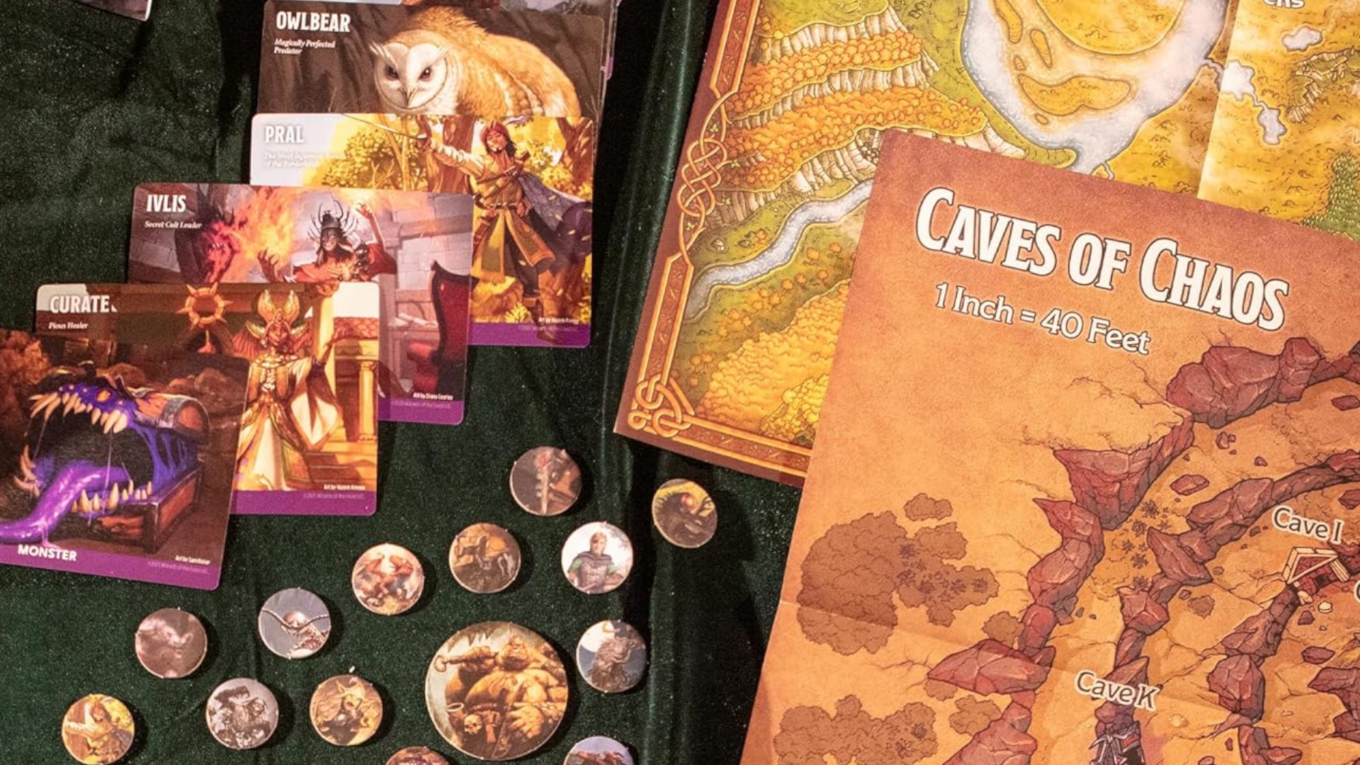 Cards, tokens, and maps from Heroes of the Borderlands laid out on a green velvet surface