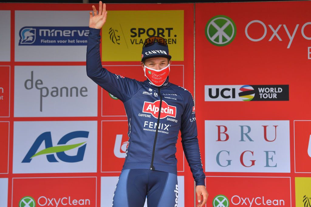 DE PANNE BELGIUM MARCH 24 Podium Jasper Philipsen of Belgium and Team AlpecinFenix Celebration during the 45th Oxyclean Brugge De Panne 2021 Men Classic a 2039km race from Brugge to De Panne Mask Covid Safety Measures OxycleanClassic on March 24 2021 in De Panne Belgium Photo by Luc ClaessenGetty Images