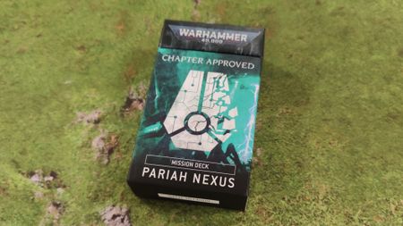 The Pariah Nexus Mission Deck pack on a grassy mat