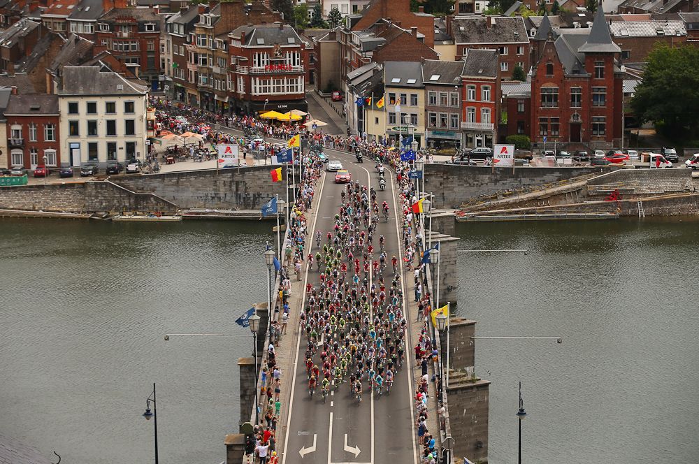 The peloton crosses a bridge during stage 4 of the 2015 Tour de France.