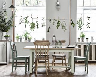 Dining area by Neptune with washing line and plants affixed by wooden pegs