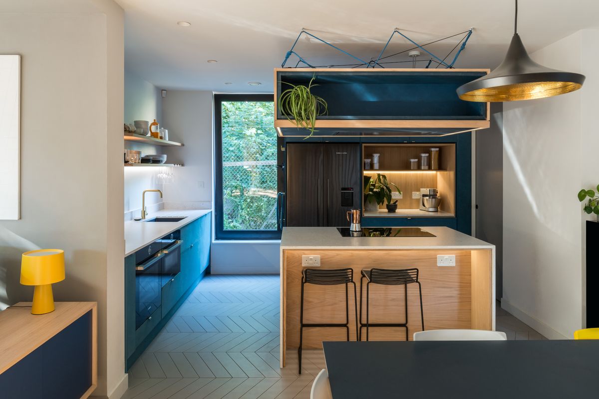 modern kitchen with lighting and dining area