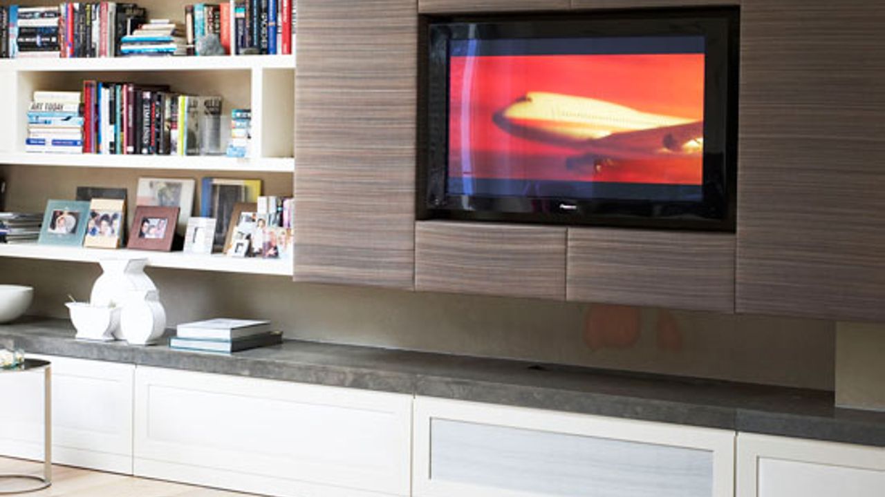 living room with tv unit and book shelf