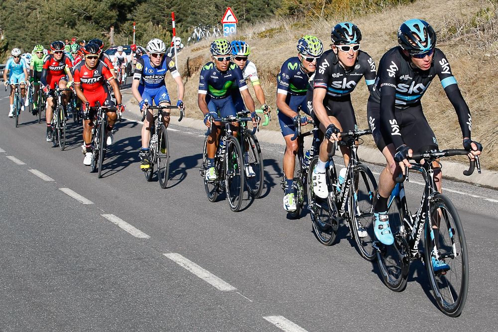 Chris Froome rides ahead of Geraint Thomas and Nairo Quintana