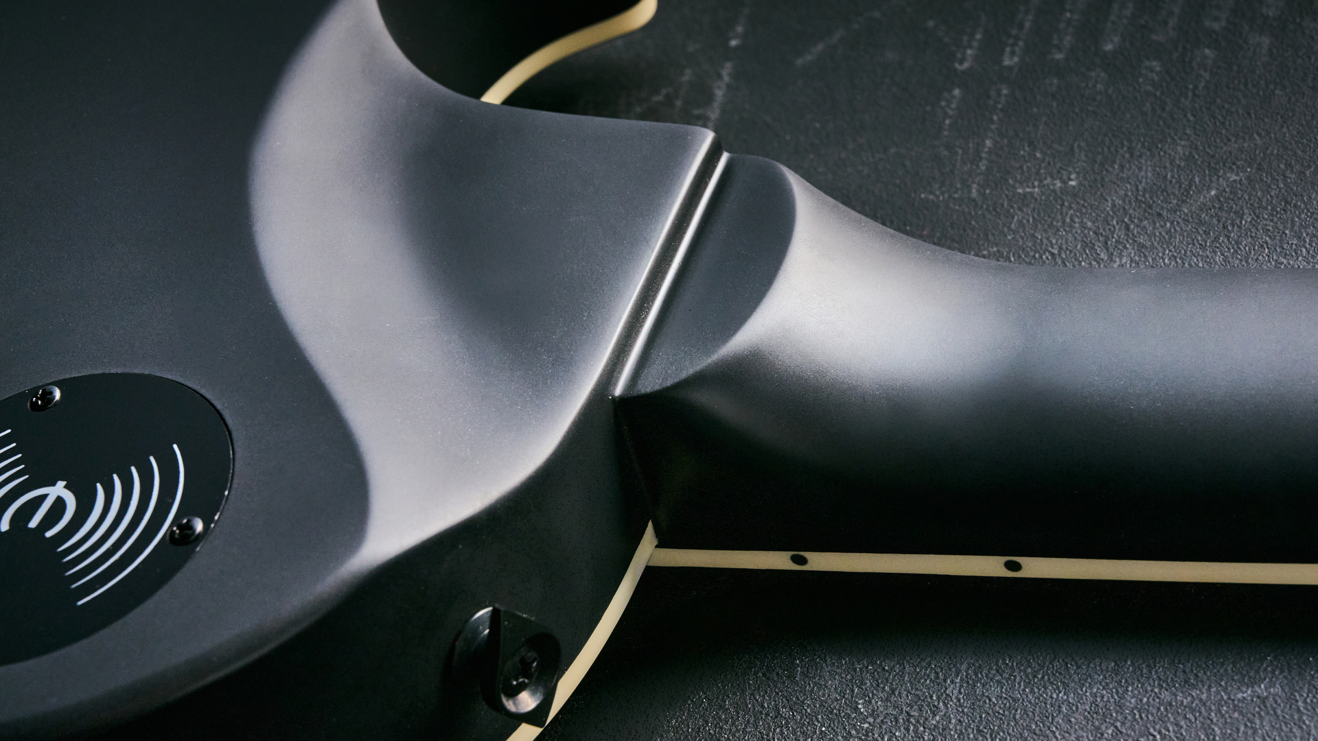 The contoured neck heel of the Epiphone Prophecy Les Paul Baritone