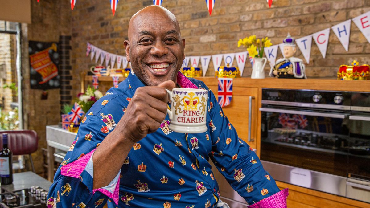 Ainsley Harriott poses with a King Charles mug for Ainsley&#039;s Coronation Kitchen