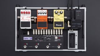 Close-up of Boss WL-50 wireless system on a pedalboard