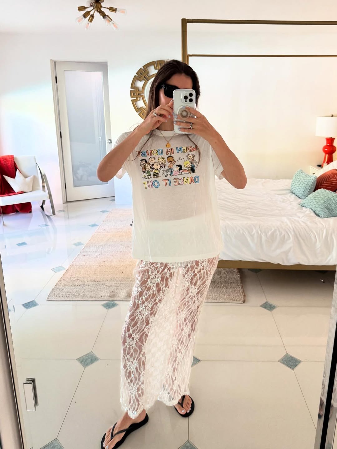 Graphic t-shirt and sheer lace skirt oufit