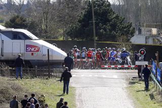 Cyclists re-start after a closed level-crossing in the 2015 Paris-Roubaix (Watson)