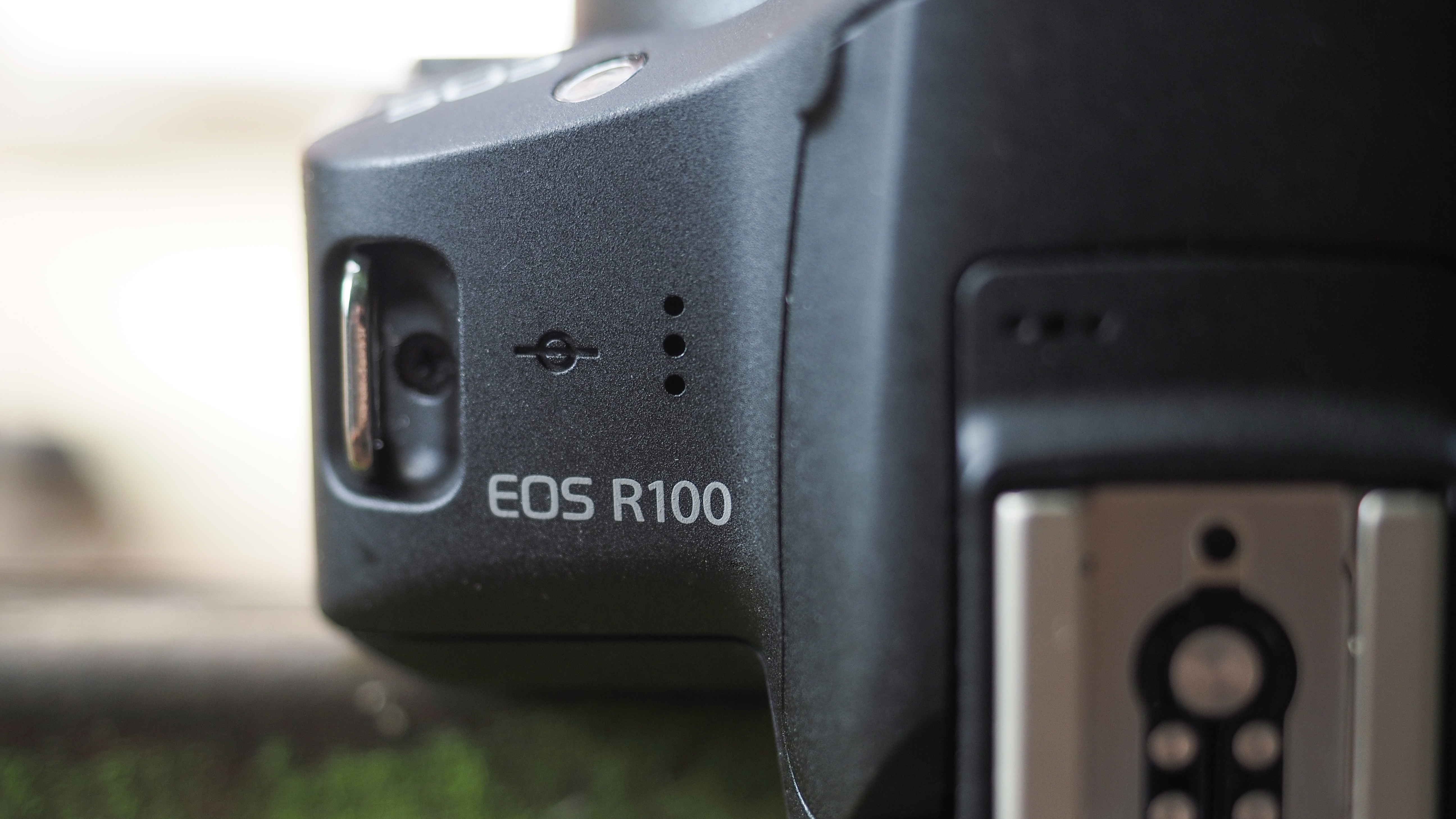 Canon APS-C cameras on a wooden surface