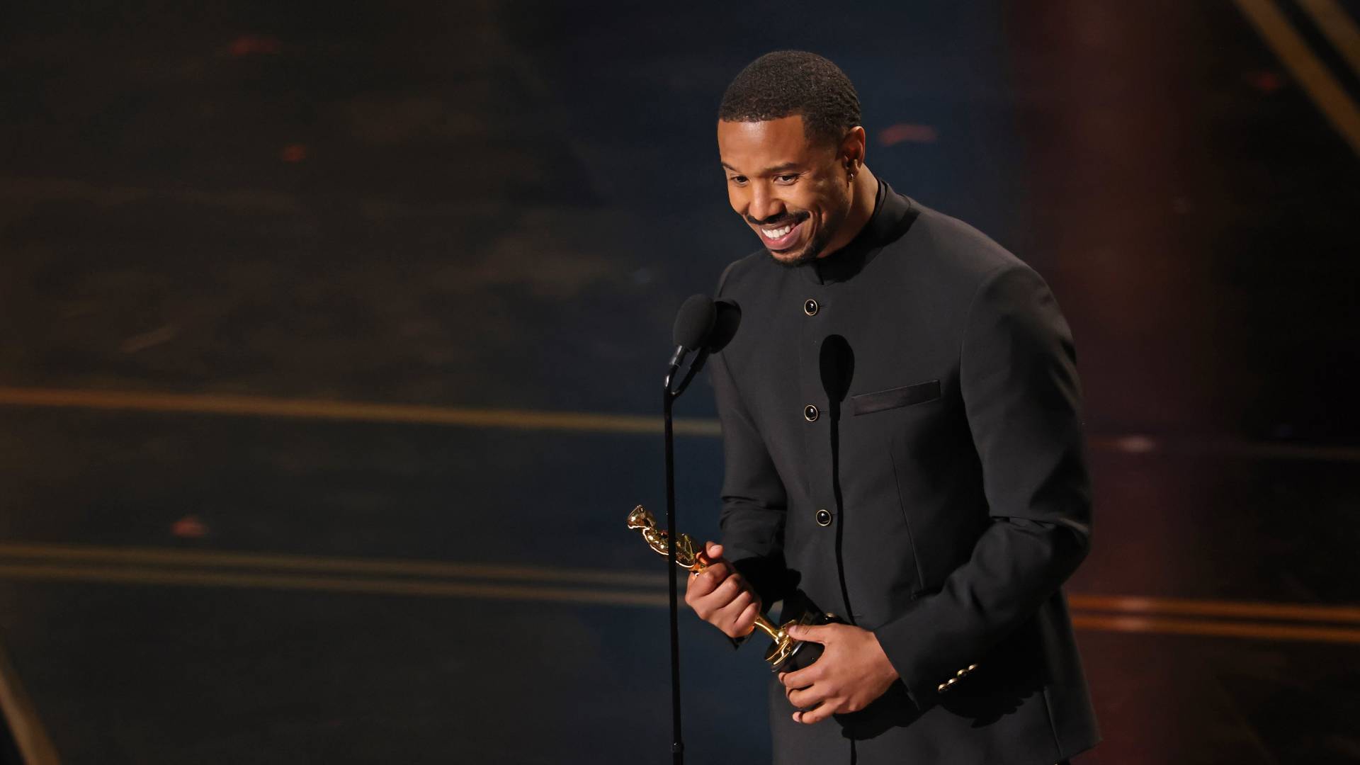 Michael B. Jordan accepting the Best Actor Oscar for Sinners