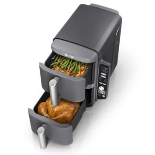 Ninja Double Stack Air Fryer with a chicken in one drawer and vegetables in another