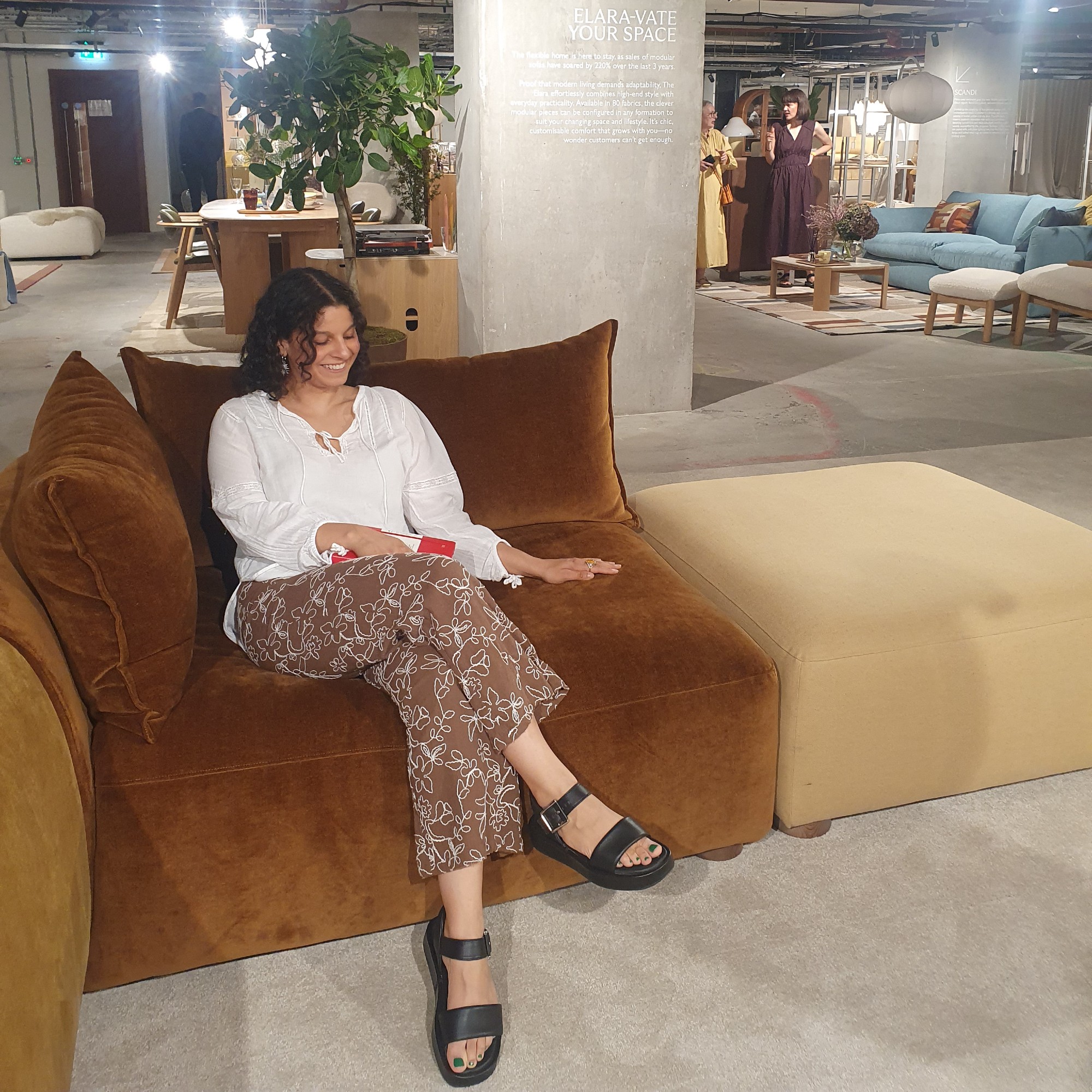 Sara trying the new John Lewis Elara sofa in at the brand's autumn/winter 2026 press preview