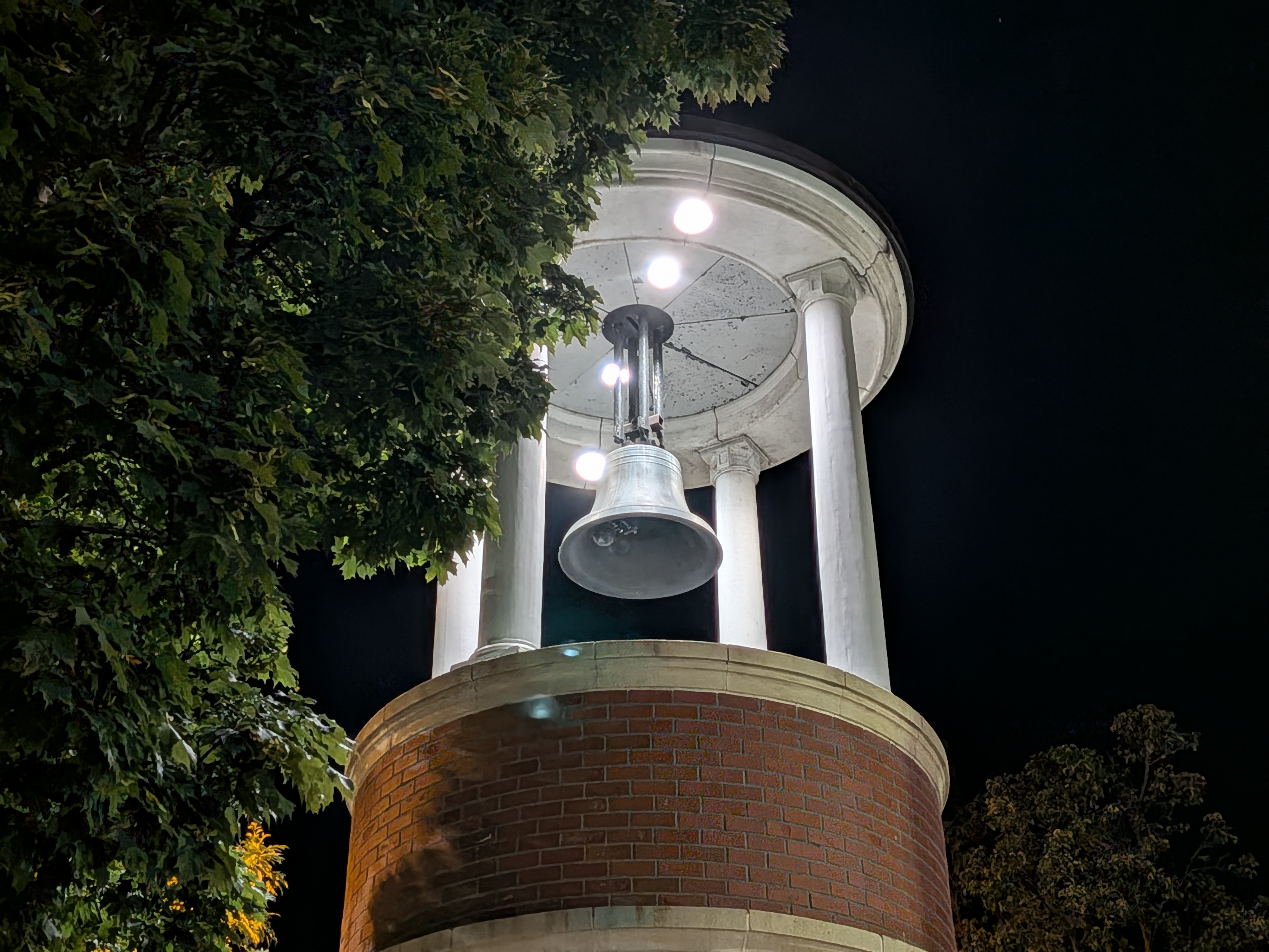 A bell tower at night