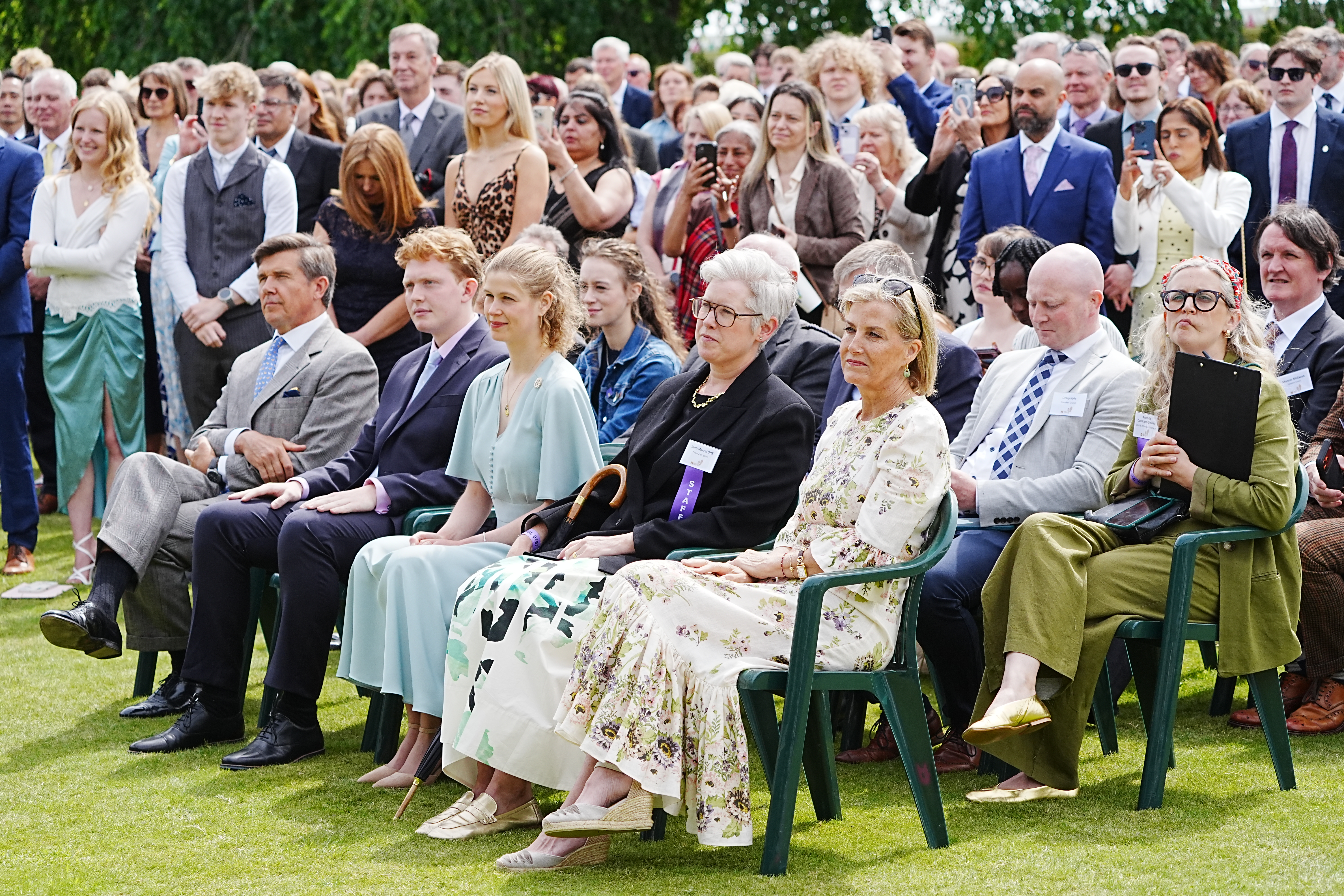 Duchess Sophie and Lady Louise sitting in a crowd for the Duke of Edinburgh Award reception
