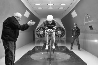 Technicians and the rider continue to seek the optimal aerodynamic TT position