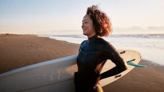 Woman holding a surfboard