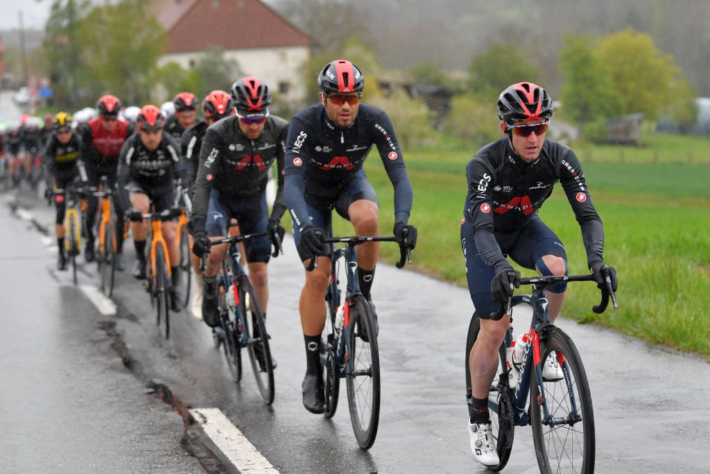 ESTAVAYER SWITZERLAND APRIL 30 Filippo Ganna of Italy Eddie Dunbar of Ireland and Team INEOS Grenadiers lead The Peloton during the 74th Tour De Romandie 2021 Stage 3 a 1687km stage from Estavayer to Estavayer Rain TDR2021 TDRnonstop UCIworldtour on April 30 2021 in Estavayer Switzerland Photo by Luc ClaessenGetty Images