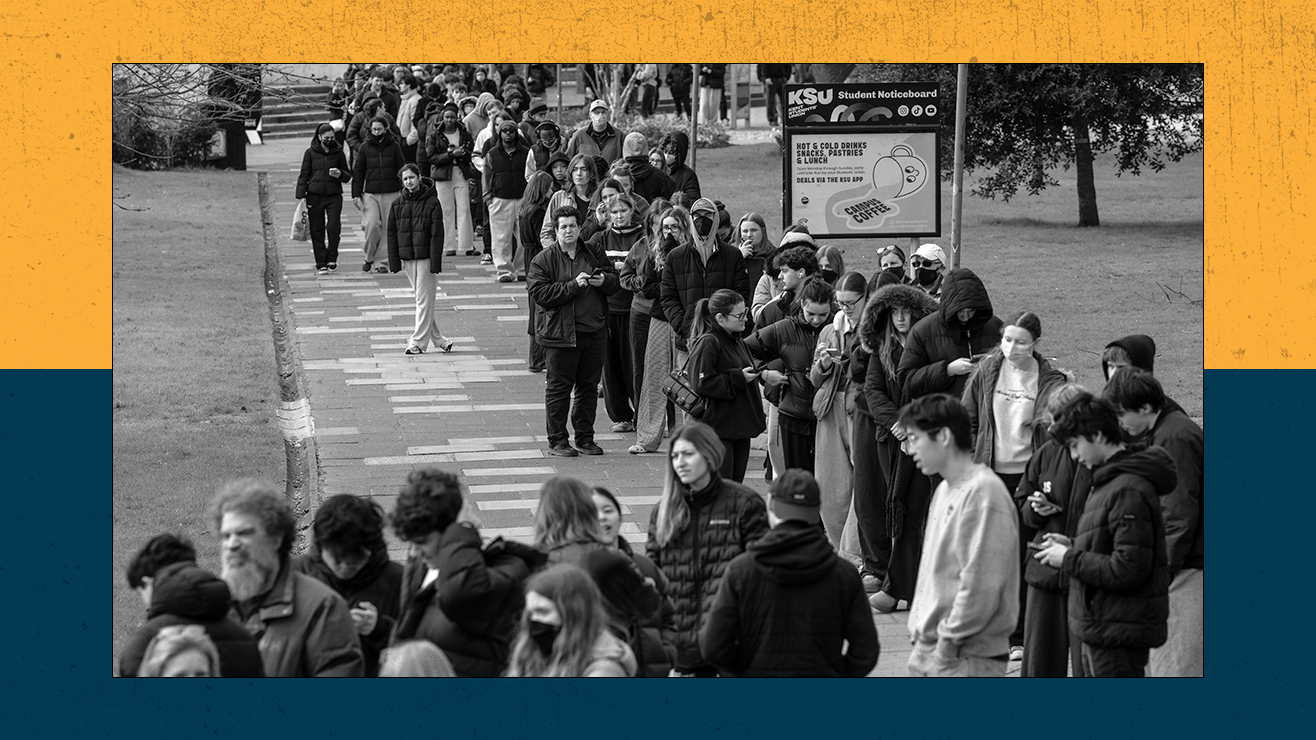 Staff and students queue to receive antibiotics at the University of Kent in Canterbury on March 16, 2026. 