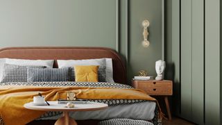 bedroom with green paneled walls, with wall light sconces, and a bedroom with an orange frame, and a side table and bedside table