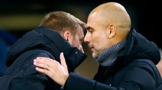 Pep Guardiola shares a word with Graham Potter during Manchester City's 4-0 win over Chelsea in the FA Cup in January 2023.