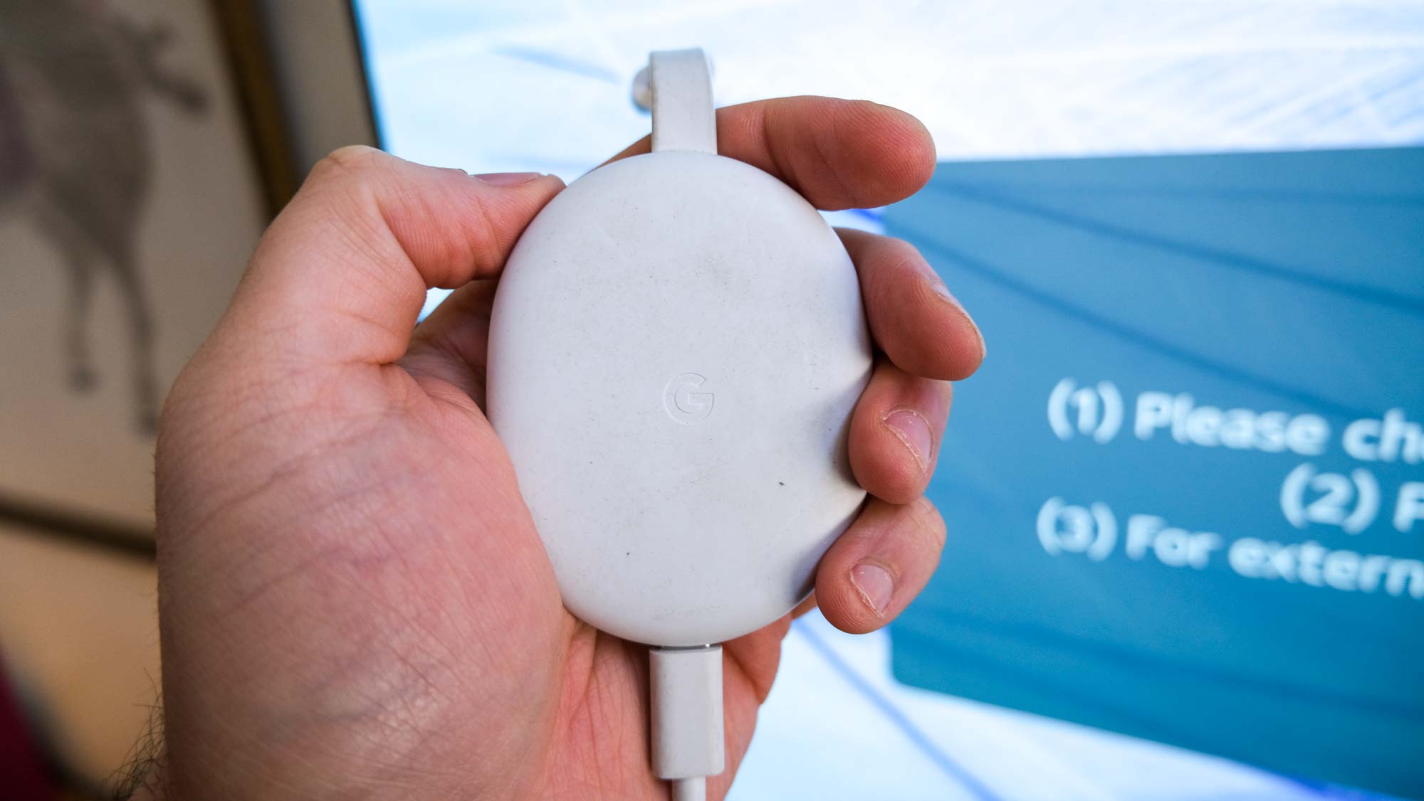 The Chromecast with Google TV in hand