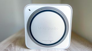 Mac Studio shown from the bottom, standing on its side