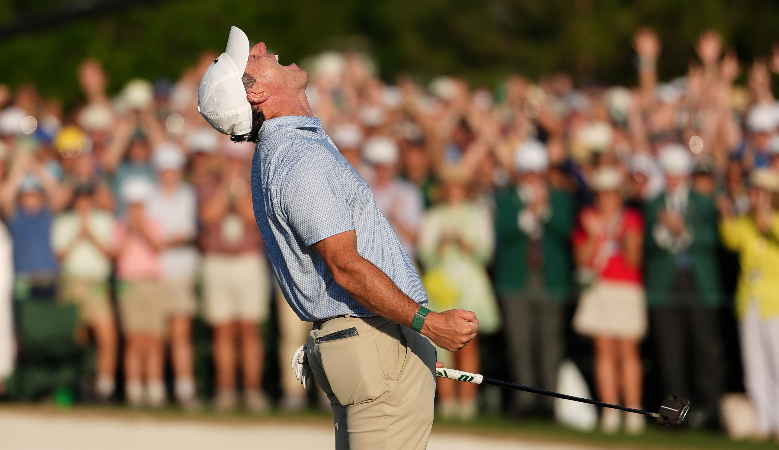 Rory McIlroy celebrates after holing the winning putt