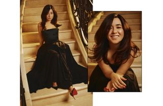 Actress Maya Erskine in a formal black gown sitting on a staircase