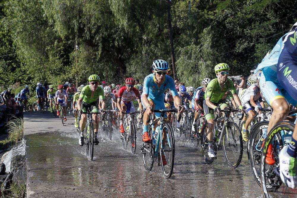 Riders make their way through a wet patch on the stage 6 route