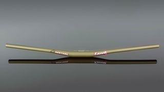 A mid-rise Renthal Fatbar in anodised gold
