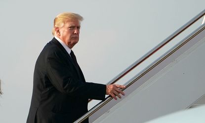 Trump boards Air Force One after Thanksgiving break