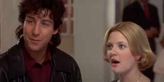 Drew Barrymore looking shocked and Adam Sandler joking in The Wedding Singer.