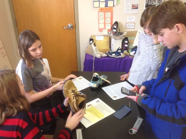 Kids examine shoes