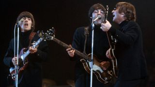 George Harrison (1943-2001), Paul McCartney and John Lennon (1940-1980) of The Beatles perform at Empire Pool in Wembley at the New Musical Express Annual Poll Winner&#039;s Concert in what would be their final scheduled performance in England, on May 1, 1966, in London, UK.