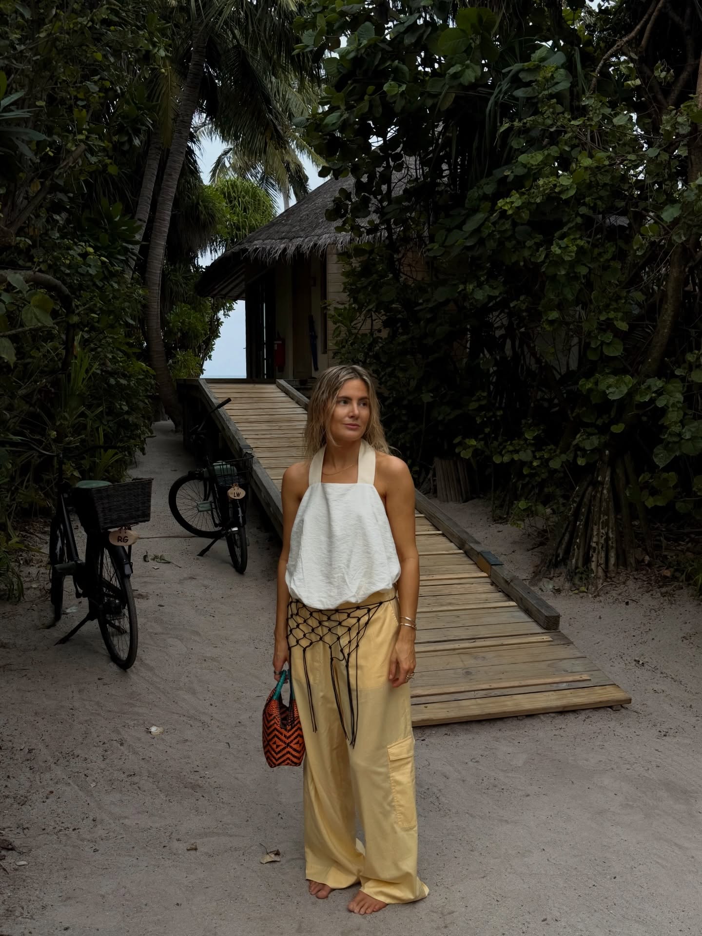 Lucy Williams on the beach wearing yellow trousers