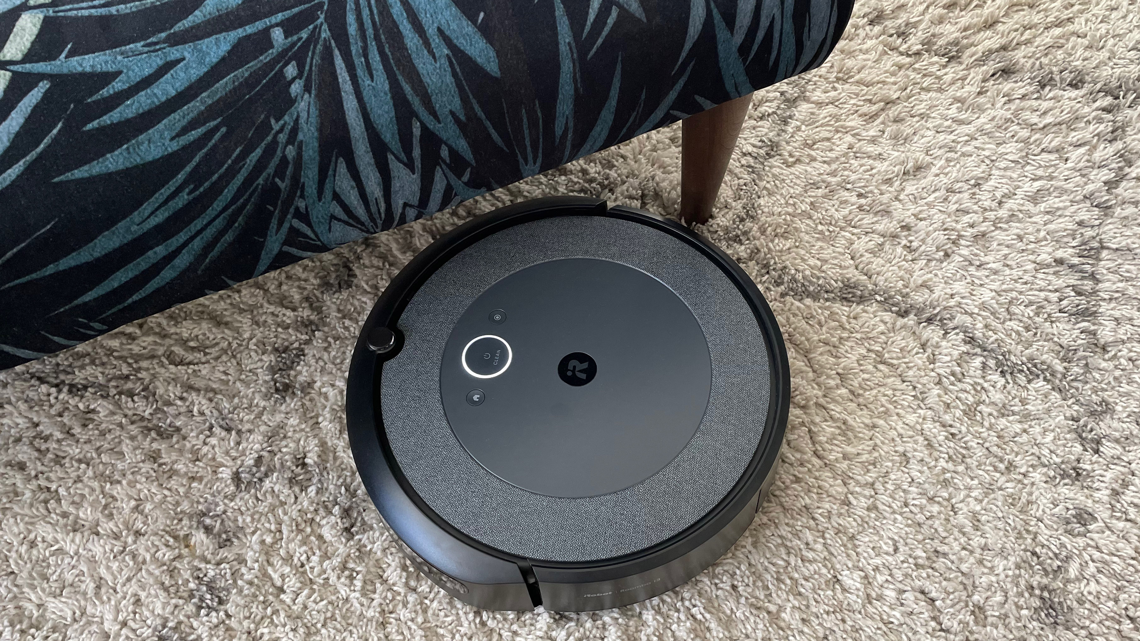 the iRobot Roomba i3 Plus cleaning underneath a chair