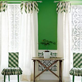 green and white living room with check curtain ties