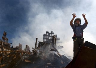 firefighter searching rubble on september 11